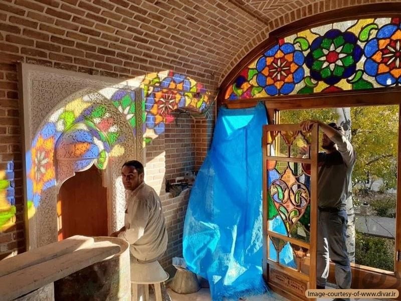 Artists installing Orosi windows